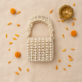 Pearl Lumière Front Flap Clutch